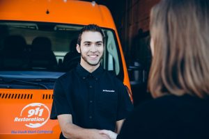 mold removal technician talking to customer